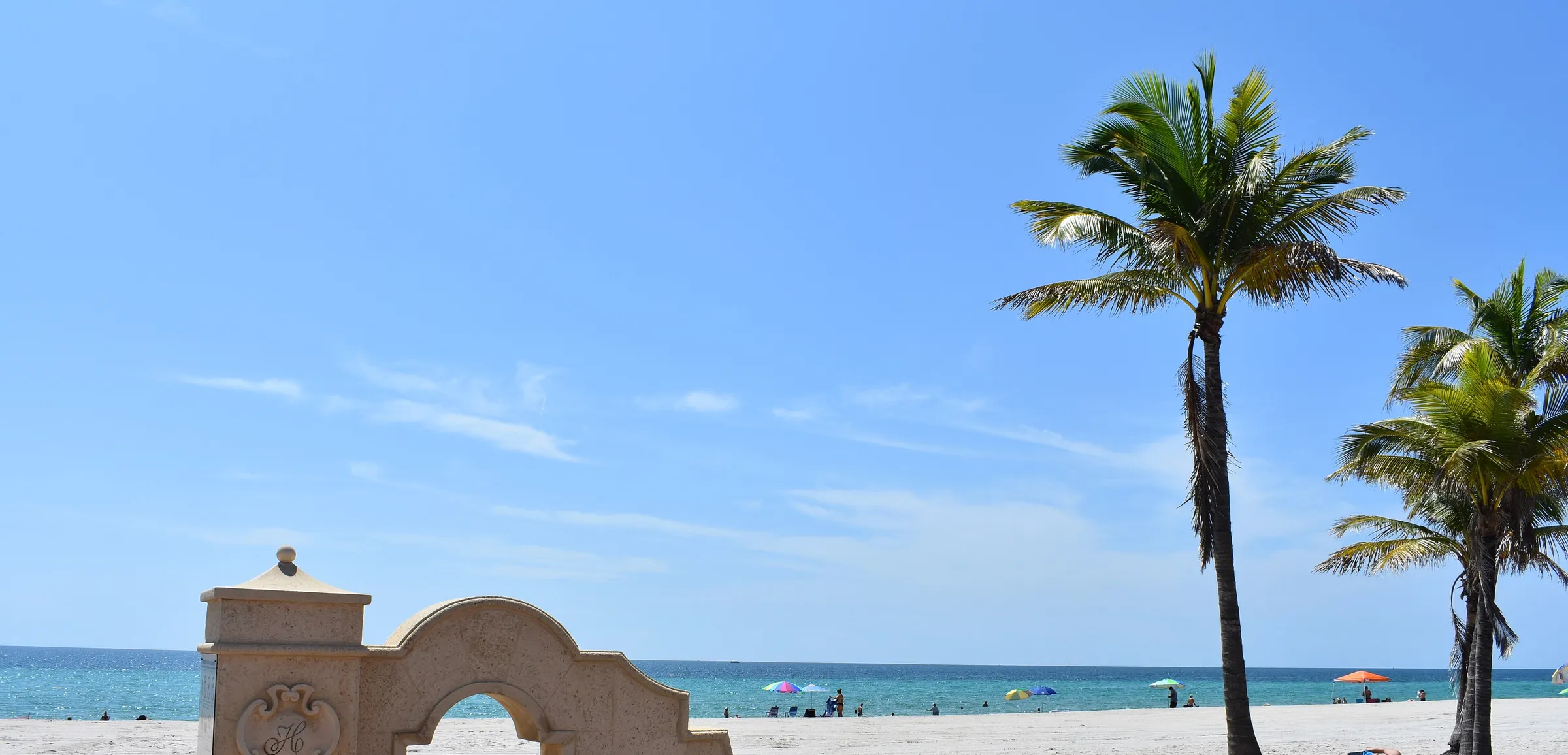 The Atlantic shoreline and palms at Hollywood Beach in Broward County, Florida